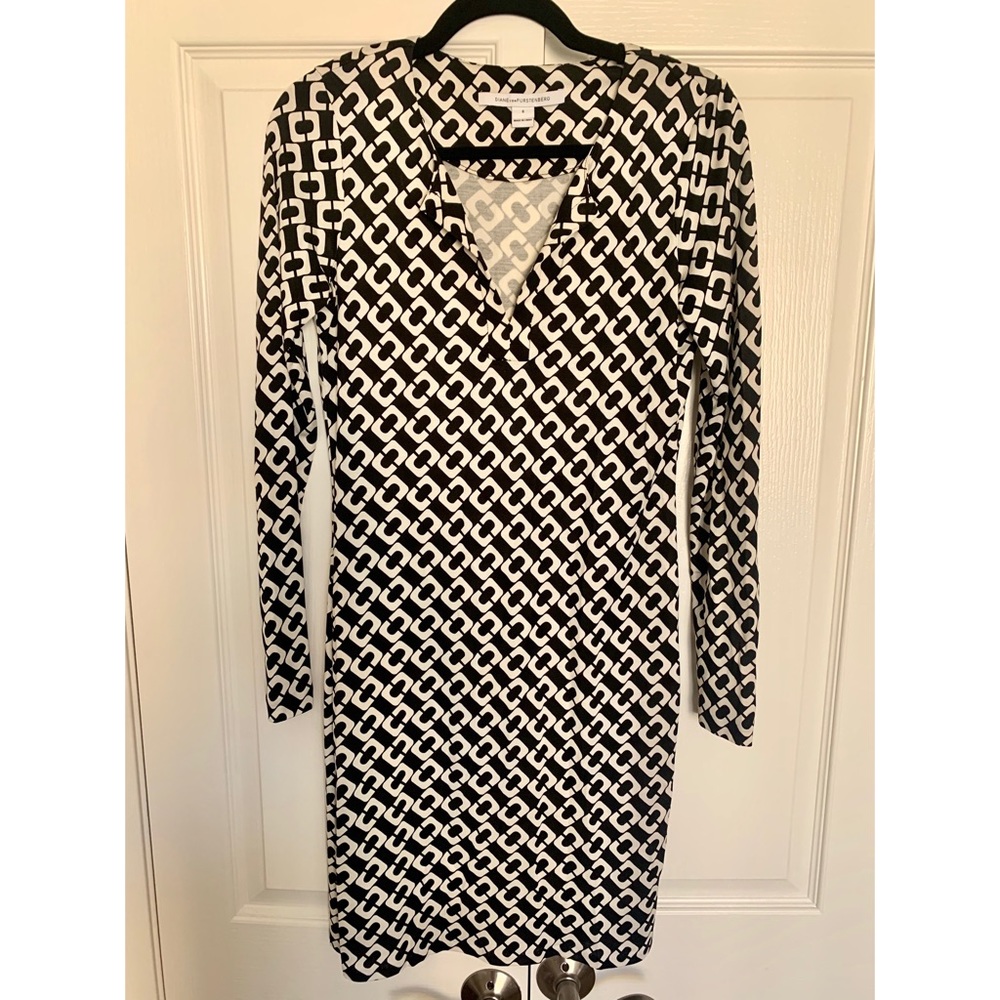Long sleeve black and white patterned dress.